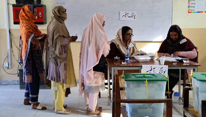 Election workers register voters at a polling station in a school during a general election, in Islamabad, Pakistan February 8, 2024. —Reuters