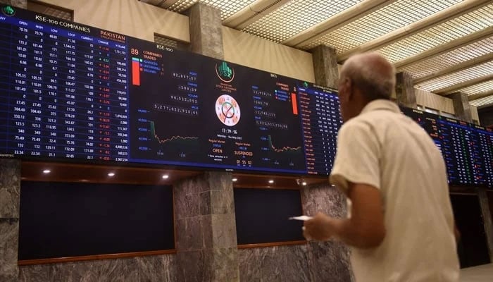 A stockbroker monitors the share prices during a trading session at the Pakistan Stock Exchange (PSX) in Karachi on May 16, 2022. — AFP