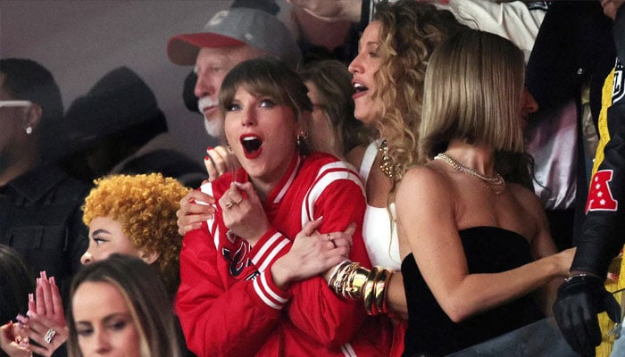 Taylor Swift reacts in the stands during overtime. —Reuters