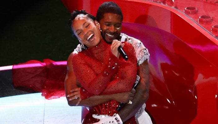 Ushers touchy hug with Alicia Keys draws reaction from her husband