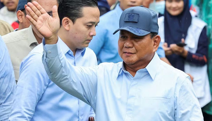 Presidential candidate Prabowo Subianto waves at a polling station during the general election in Bogor, West Java, Indonesia, February 14, 2024. — Reuters