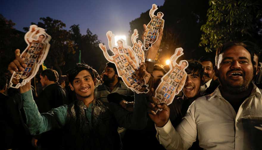 Supporters of Former prime minister Nawaz Sharif cheer as they gather at the party office of Pakistan Muslim League (N) at Model Town in Lahore. —Reuters