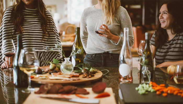 A group of women enjoying each others company with snacks. — Unsplash