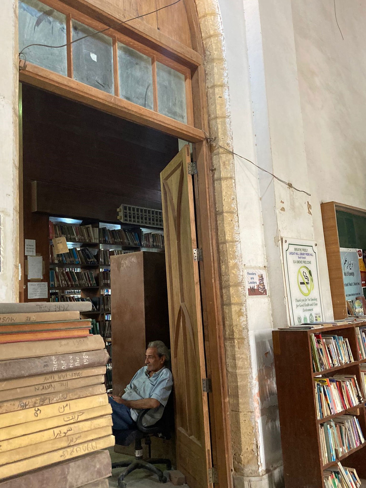 A librarian at the Frere Hall is seen sitting inside the library. — Photo by author