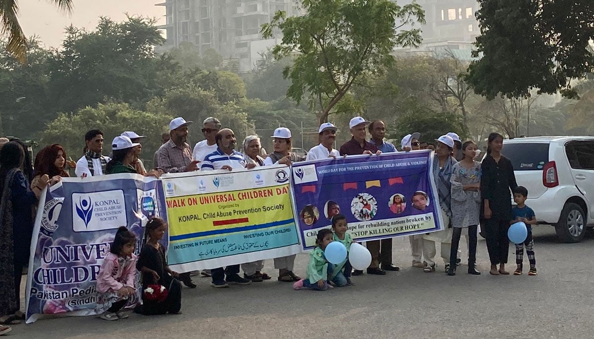 A group of men and women protest against child abuse at the Frere Hall. — Photo by author