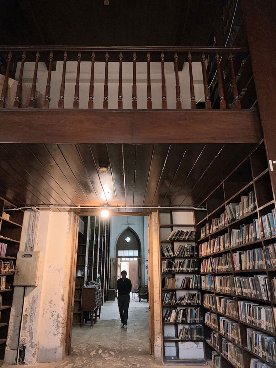 A man walks inside the library at the Frere Hall. — Photo by author
