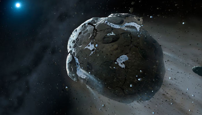 This is an artist’s impression of a rocky and water-rich asteroid being torn apart by the strong gravity of the white dwarf star GD 61. — Mark A Garlick, Space-art.co.uk / University of Warwick / University of Cambridge/File