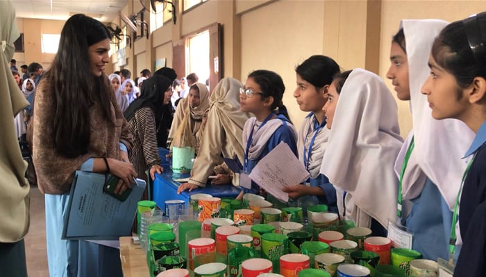 Students brief a judge about the low-cost sustainable cooling solution theyre created. — Photo by author