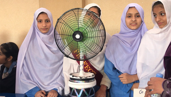 Students are photographed alongside their project. — Photo by author