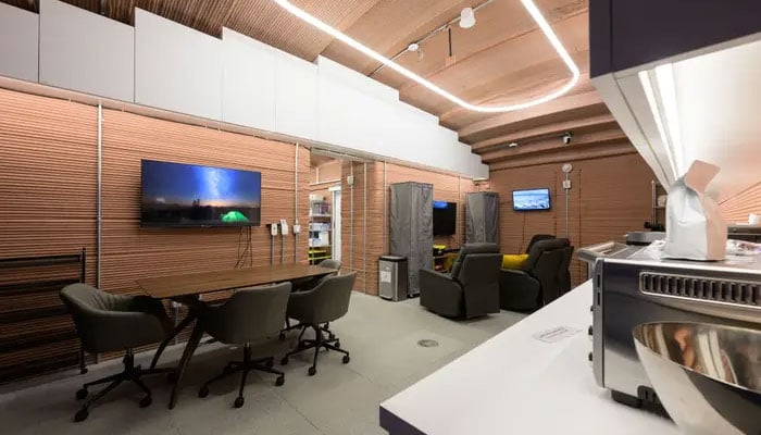 The living quarters inside the CHAPEA habitat include a conference area, a TV, and kitchen appliances. — Nasa/File