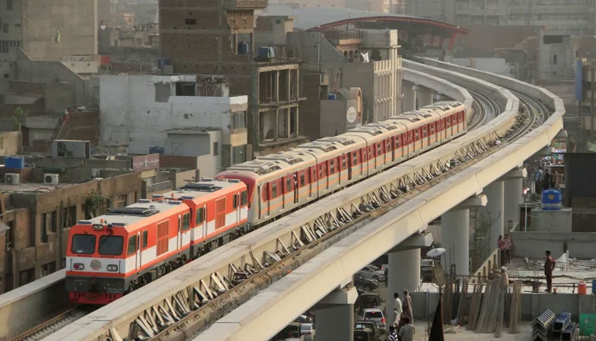 The Orange Line Metro Train on its first test run, travels along a track in a neighbourhood in Lahore, Pakistan on May 16, 2018. — Reuters