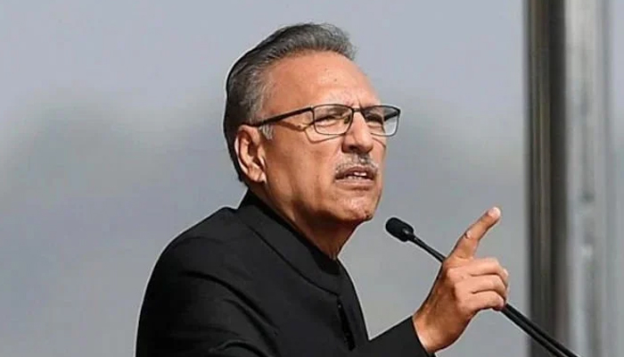 President Arif Alvi gestures during an address. — AFP/File