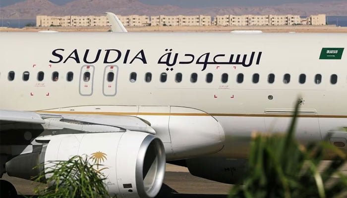 Saudi Arabian Airlines plane, is seen at the airport of the Red Sea resort of Sharm el-Sheikh, Egypt, August 9, 2021. Picture taken through a window. — Reuters