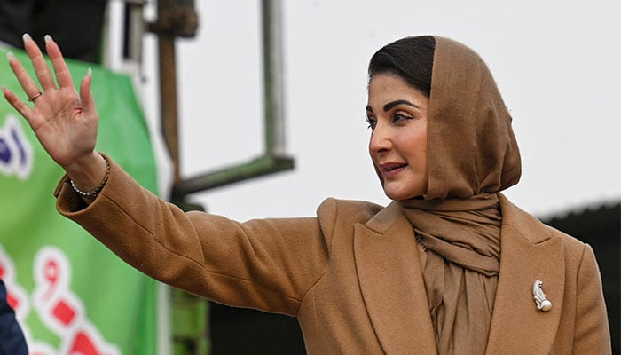 PML-N stalwart Maryam Nawaz waves to her party supporters during an election campaign at Mansehra in Khyber Pakhtun province on January 22, 2024. — AFP