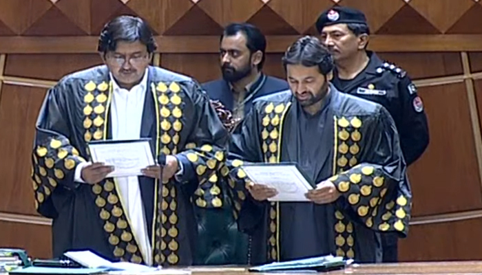 Punjab Assembly Speaker Malik Ahmed Khan (left) administers oath to newly-elected Deputy Speaker Malik Zaheer Ahmed Channer during an assembly session, on February 24, 2024, in this still taken from a video. — YouTube