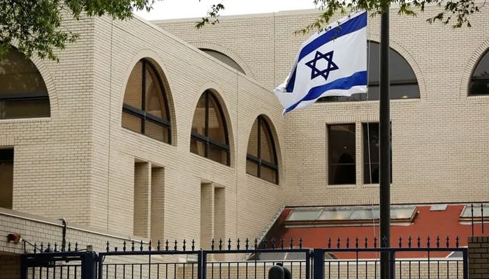 The Israeli flag flies at half-staff at the Israeli Embassy in Washington, September 30, 2016. — Reuters