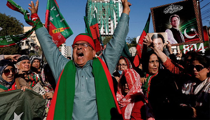 PTI supporters chant slogans during a protest outside the provincial election commission office in Karachi, February 17, 2024. — Reuters