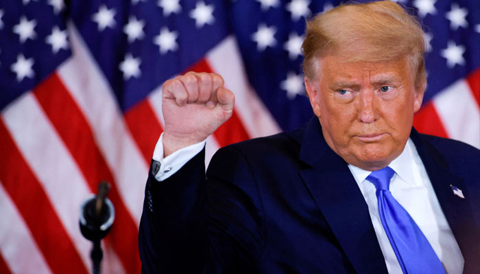 US President Donald Trump raises his fist as he reacts to early results from the 2020 US presidential election in the East Room of the White House in Washington, US, November 4, 2020. —Reuters