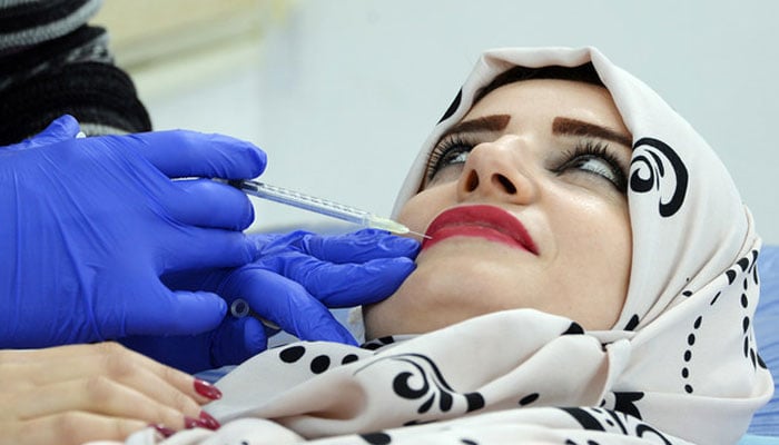 A woman is undergoing cosmetic procedures. — AFP/File