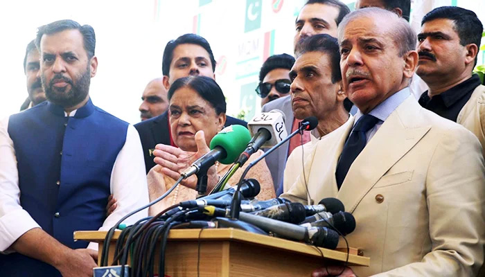 PML-N President Shehbaz Sharif (right) addresses the media after a meeting with MQM-Ps top leaders ahead of the 2024 general elections in Lahore on December 29, 2023. — Online