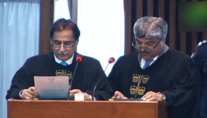 NA Speaker Ayaz Sadiq (left) administers oath to NAs newly elected Deputy Speaker Syed Ghulam Mustafa Shah in the lower houses session in Islamabad, on March 1, 2024, in this still taken from a video. — YouTube/@PTVParliament