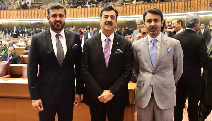 Former prime minister Syed Yusuf Raza Gilani was photographed with his sons on the floor of the National Assembly on February 29, 2024. — X/@Fiza_Gilani
