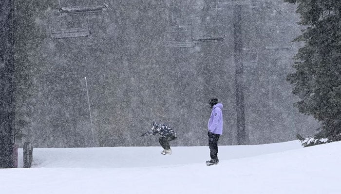 Skiers enjoy a day of skiing and snowfall at North Star California Resort in Truckee, California on February 29, 2024. — AFP
