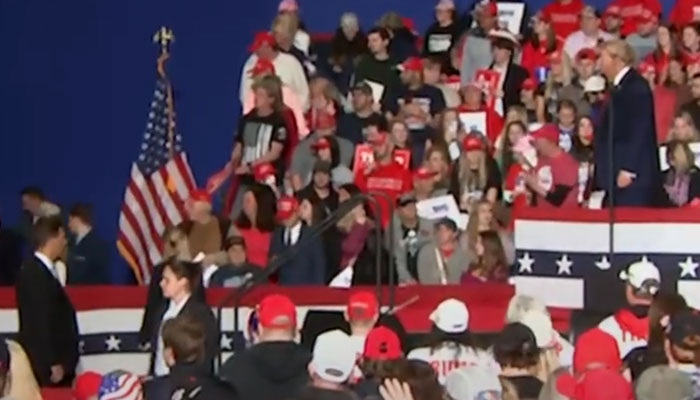 Donald Trump is silently watching the medical help is being given. — YouTube/Howard Mortman screenshot