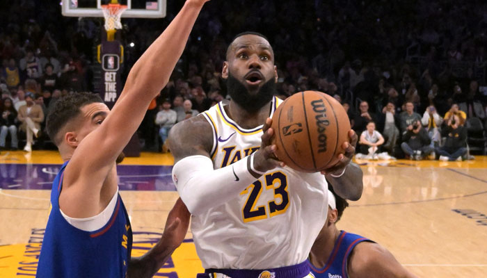 Los Angeles Lakers forward LeBron James (23) drives past Denver Nuggets forward Michael Porter Jr (1) and forward Zeke Nnaji (22) to score his 40,000th career point at Crypto.com Arena in Los Angeles, California, US on March 2, 2024. — Reuters