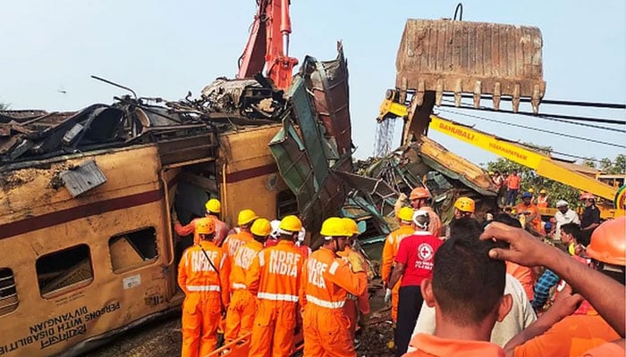 Hundreds of emergency workers were at the site to clear the wreckage.— AFP
