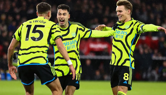 Arsenals players celebrating their win against Sheffield United. — AFP