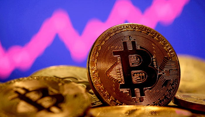 A representation of virtual currency Bitcoin is seen in front of a stock graph in this illustration taken January 8, 2021. —Reuters