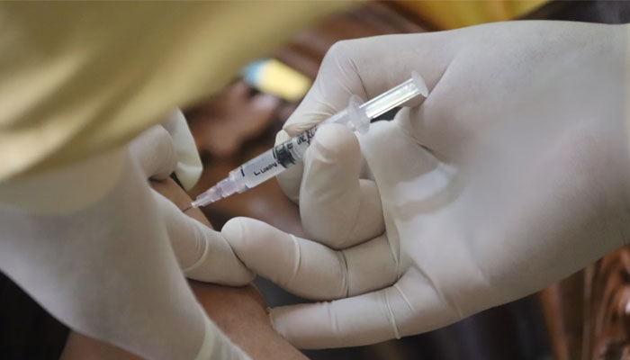 A representational image showing a doctor administers a vaccine via a syringe. — Unsplash