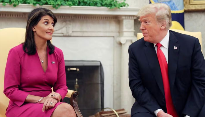 Ex-US President Donald Trump talks with former UN Ambassador Nikki Haley in the Oval Office of the White House on October 9, 2018. —Reuters