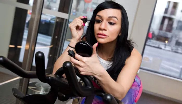 Stephanie Becerra touches up her makeup before a workout at CYC Fitness in Chelsea. — NY Post