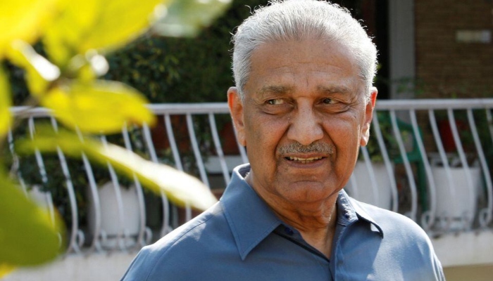 Nuclear scientist Abdul Qadeer Khan smiles at the media outside his residence in Islamabad on February 6, 2009. —Reuters