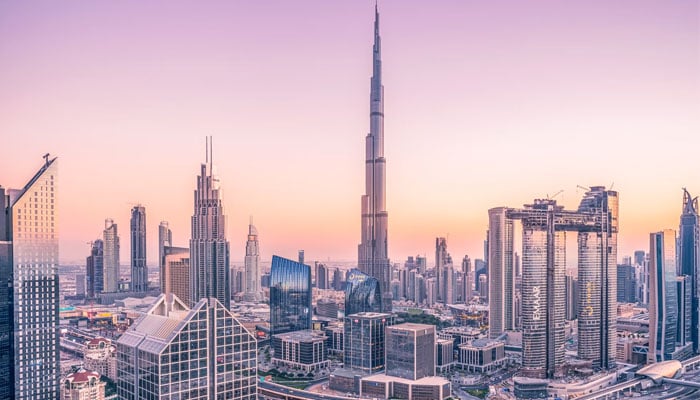 An aerial view of Dubai shows the worlds tallest building, the Burj Khalifa (centre). — Unsplash
