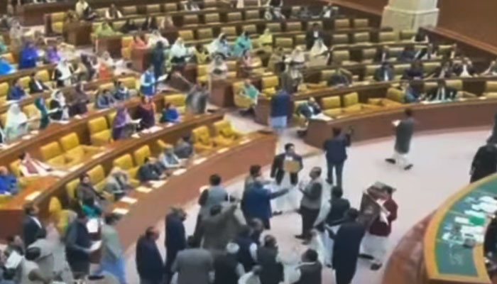 PTI-backed SIC lawmakers gather before the speakers dice inside the Punjab Assembly, in this still taken from a video. — YouTube/Geo News Live