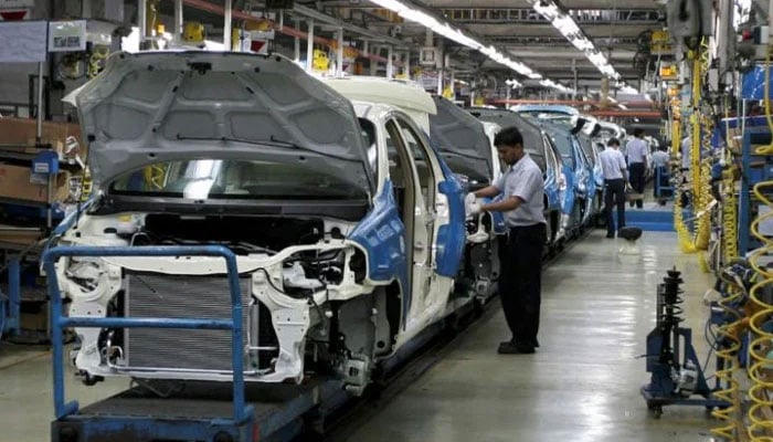 Cars being manufactured in this undated image. — Reuters/File