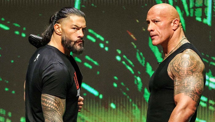 This undated image shows Undisputed WWE Universal Champion Roman Reigns (left) and WWE legend Dwayne The Rock Johnson. — Sports Illustrated