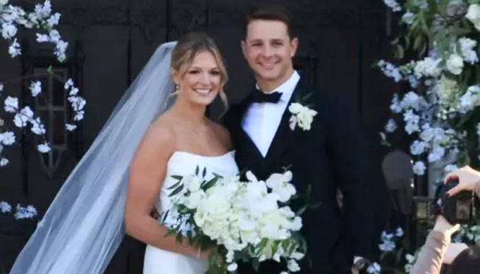 San Francisco 49ers quarterback Brock Purdy poses with wife Jenna Brandt outside his wedding venue in Des Moines, Iowa on March 9, 2024. — Backgrid