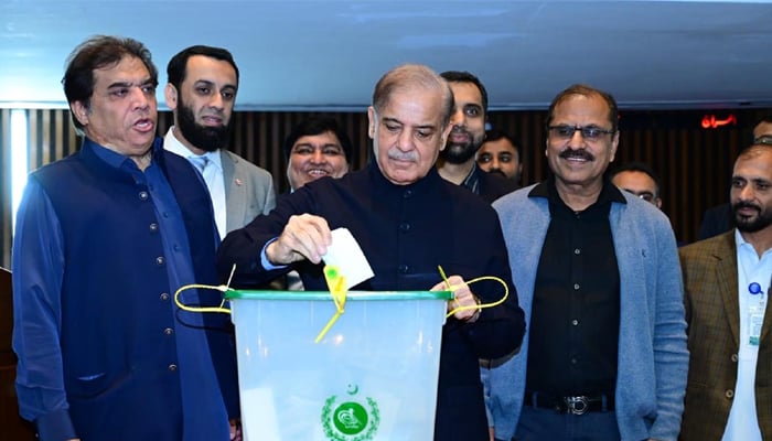 Prime Minister Shehbaz Sharif casts his vote in Senate by-polls at the Parliament House in Islamabad on March 14, 2024. — PID