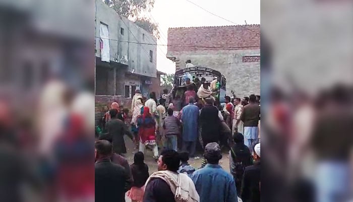 Stampede can be seen during ration distribution under Ramadan Nigehban Relief Package in Lahore on January 13, 2024, in this still taken from a video. — Reporter