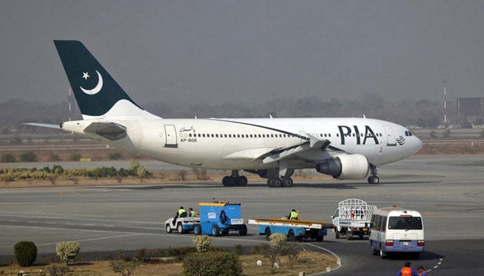 A Pakistan International Airlines (PIA) plane prepares to take off at Alama Iqbal International Airport in Lahore on February 1, 2012. — Reuters