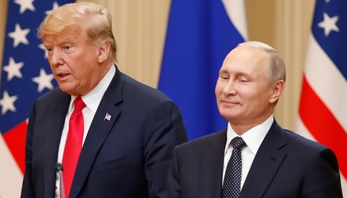 US president Donald Trump and Russian President Vladimir Putin arrive for a joint news conference after their meeting in Helsinki in July 2018. — Reuters