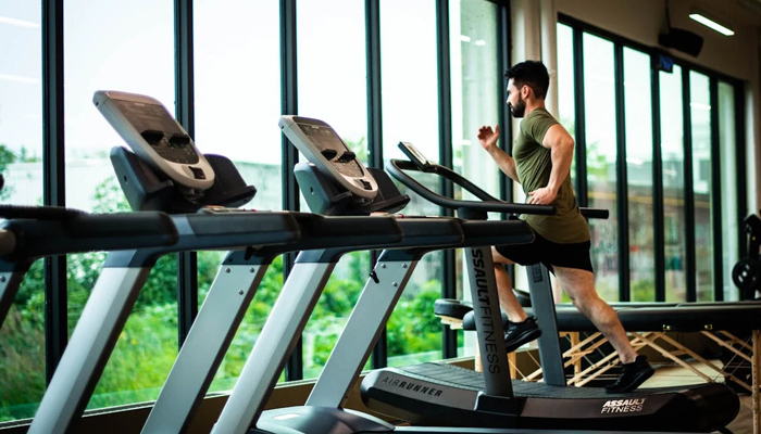 A representational image of a person during an exercise on a trade mill. — Pexels