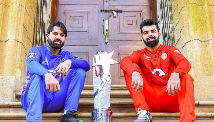 Multan Sultans skipper Mohammad Rizwan (left) and Islamabad United captain Shadab Khan pose with the PSL 9 trophy. — X/thePSLt20