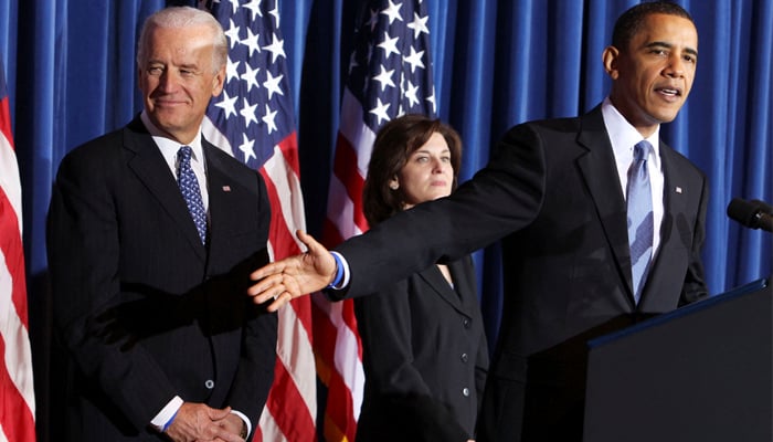 The then-US President Barack Obama (R), Vice President Joseph Biden (L) and Vicki Kennedy during a celebrating rally at the Interior Department in Washington, March 23, 2010. — Reuters
