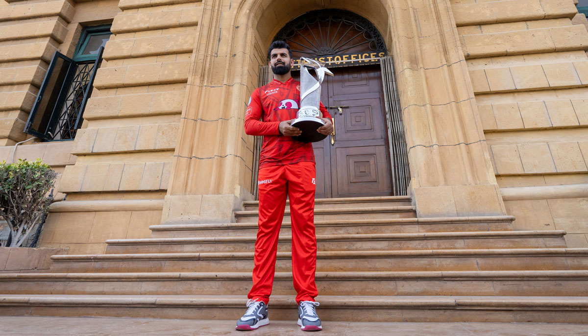 Islamabad United captain Shadab Khan holds the PSL 9 trophy ahead of the final match in Karachi. — PCB