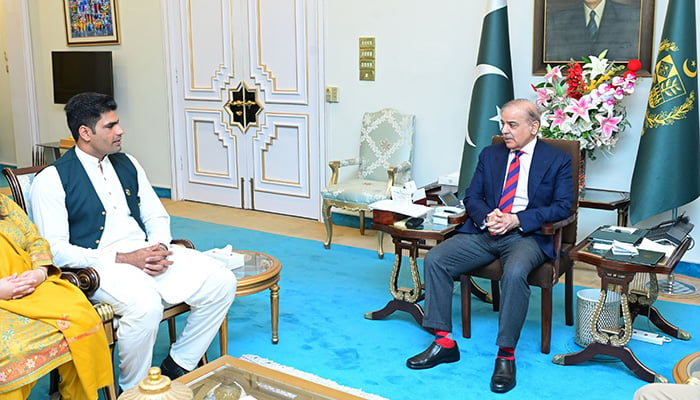 Pakistan’s ace javelin thrower Arshad Nadeem calls on Prime Minister Shehbaz Sharif (right) on March 19, 2024. — PID